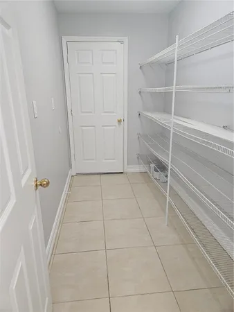 a view of an empty walk in closet