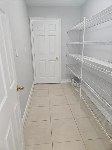 a view of an empty walk in closet