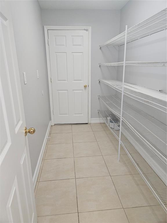 Undisclosed Address Orlando, FL 32818 - Photo 25 of 26 a view of an empty walk in closet