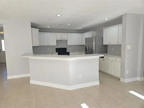 a view of kitchen with stainless steel appliances