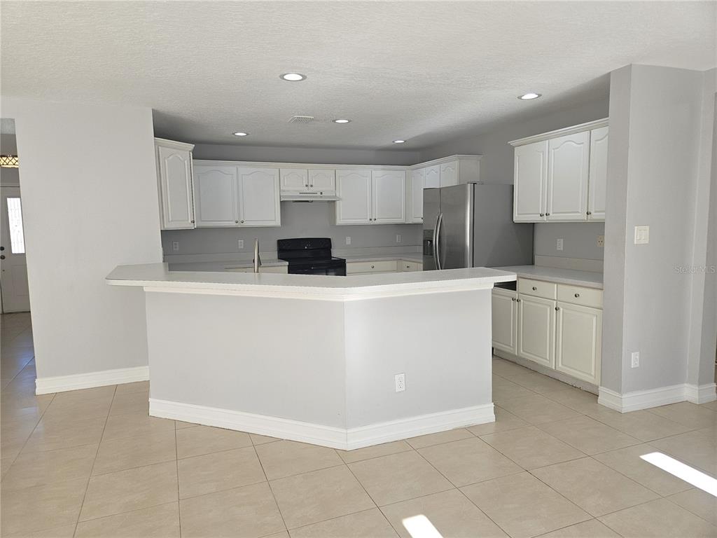 Undisclosed Address Orlando, FL 32818 - Photo 8 of 26 a view of kitchen with stainless steel appliances