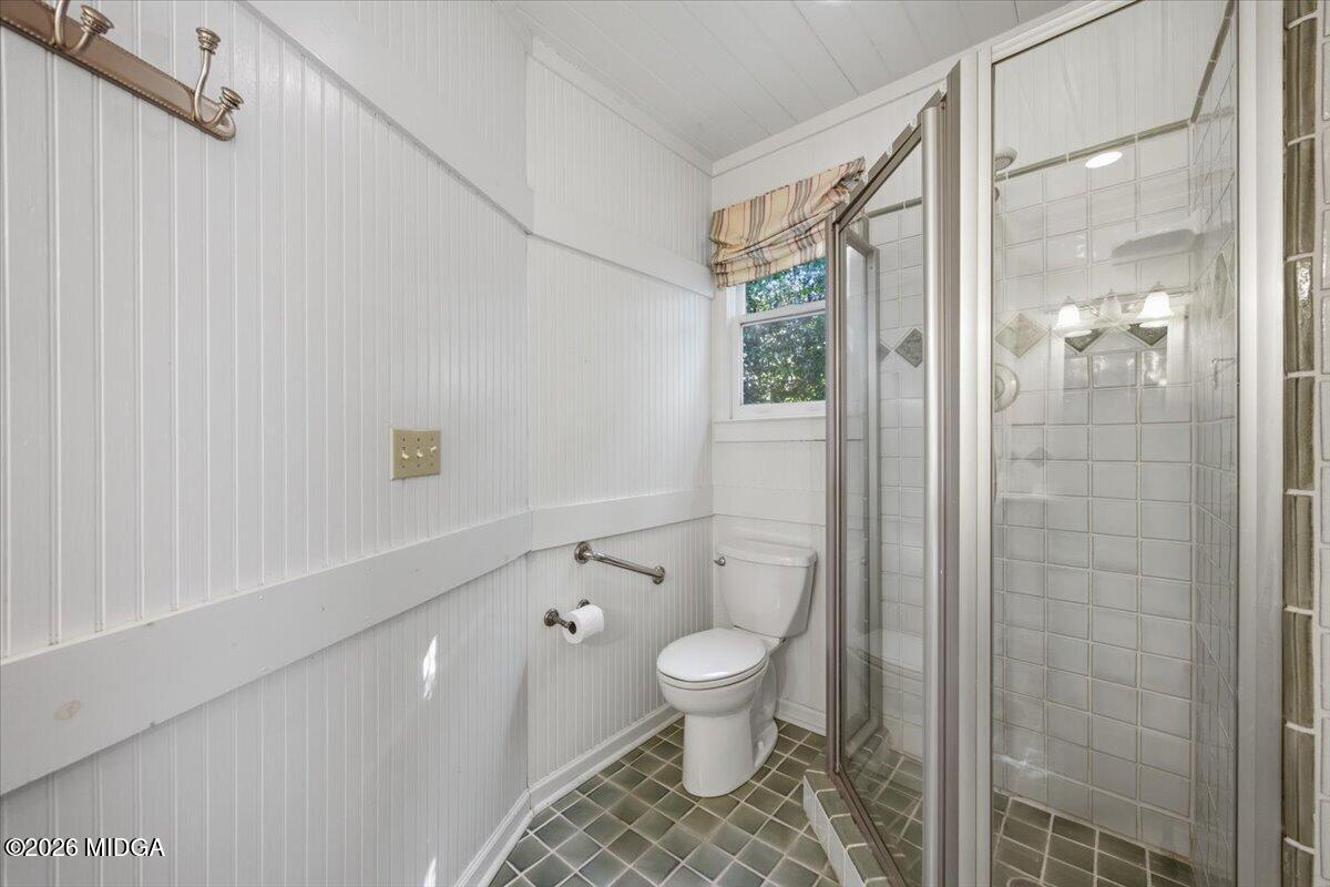 1019 Bond Street Macon, GA 31201 - Photo 12 of 56 a bathroom with a toilet and a shower