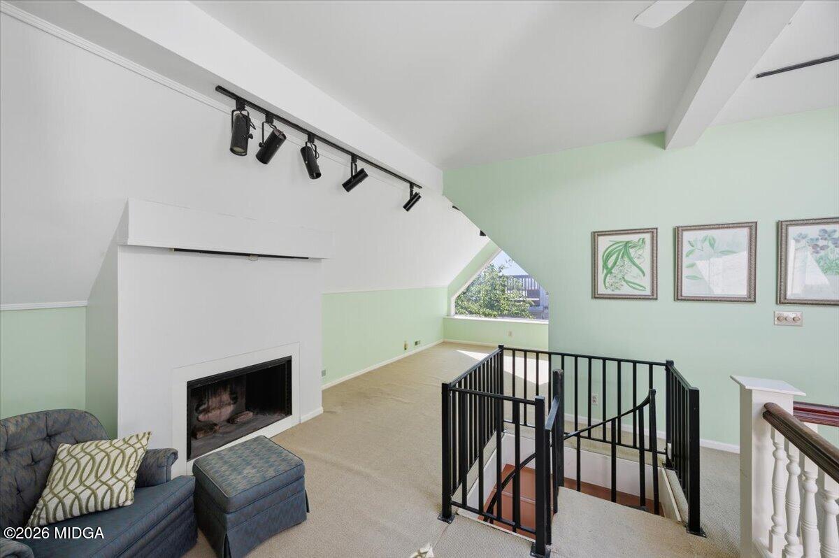 1019 Bond Street Macon, GA 31201 - Photo 14 of 56 a living room with furniture and a fireplace