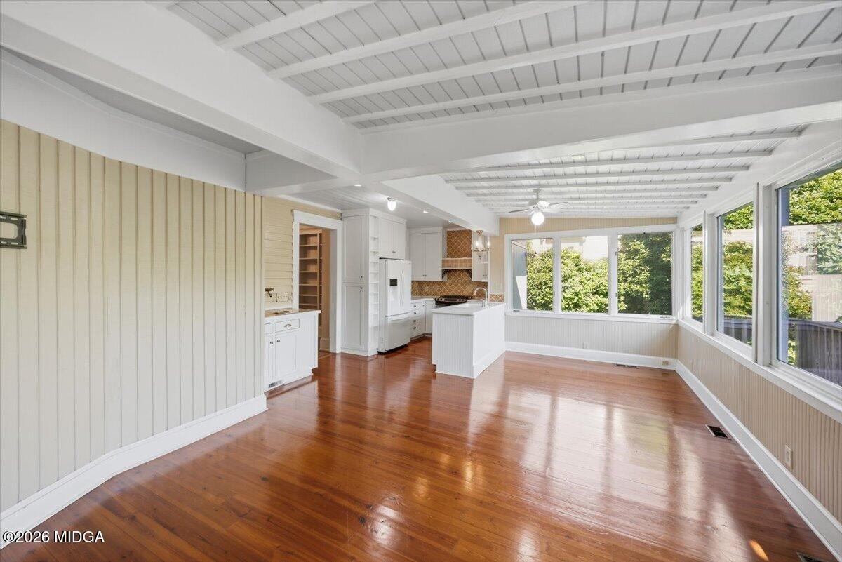 1019 Bond Street Macon, GA 31201 - Photo 24 of 56 a view of open kitchen with wooden floor and windows