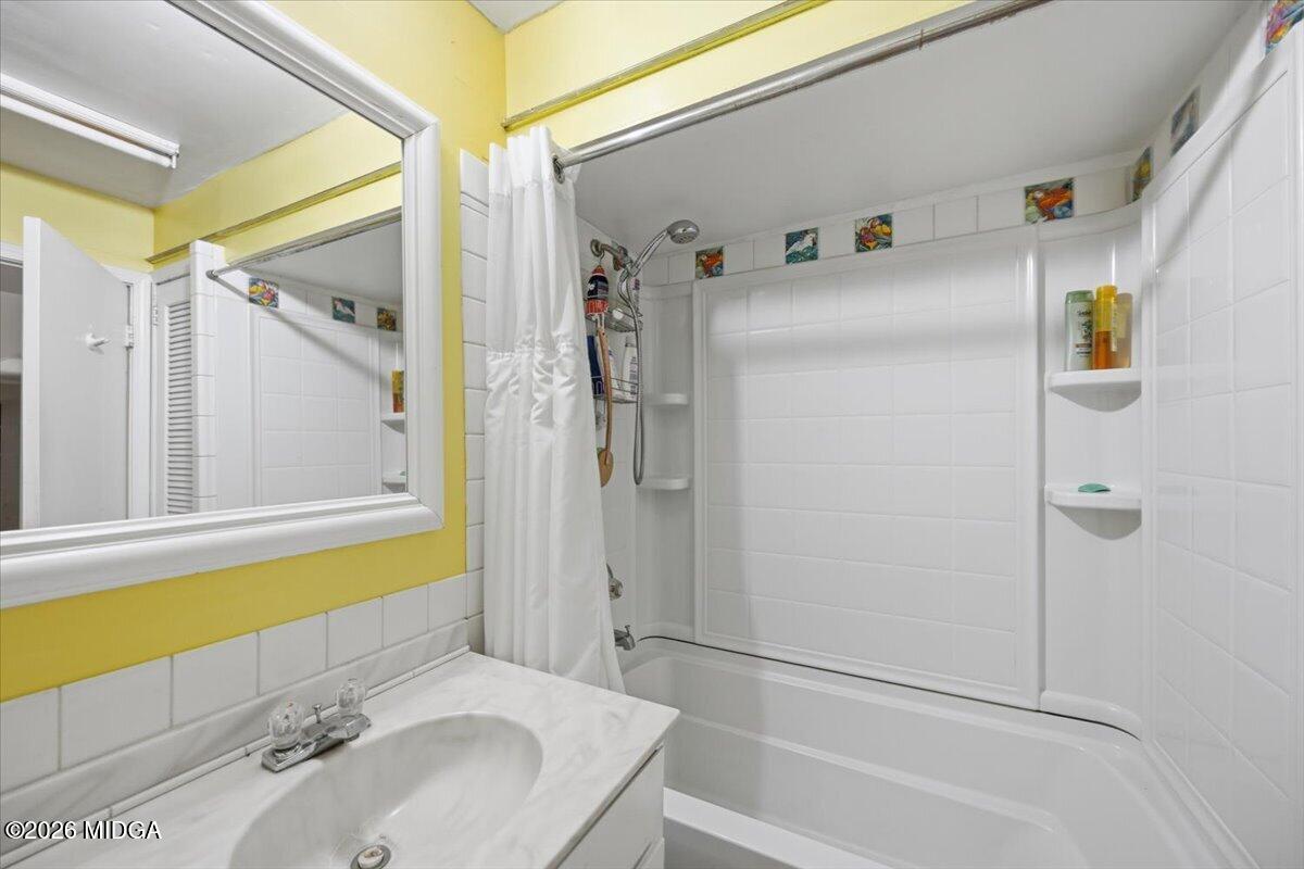 1019 Bond Street Macon, GA 31201 - Photo 33 of 56 a bathroom with a tub and a sink
