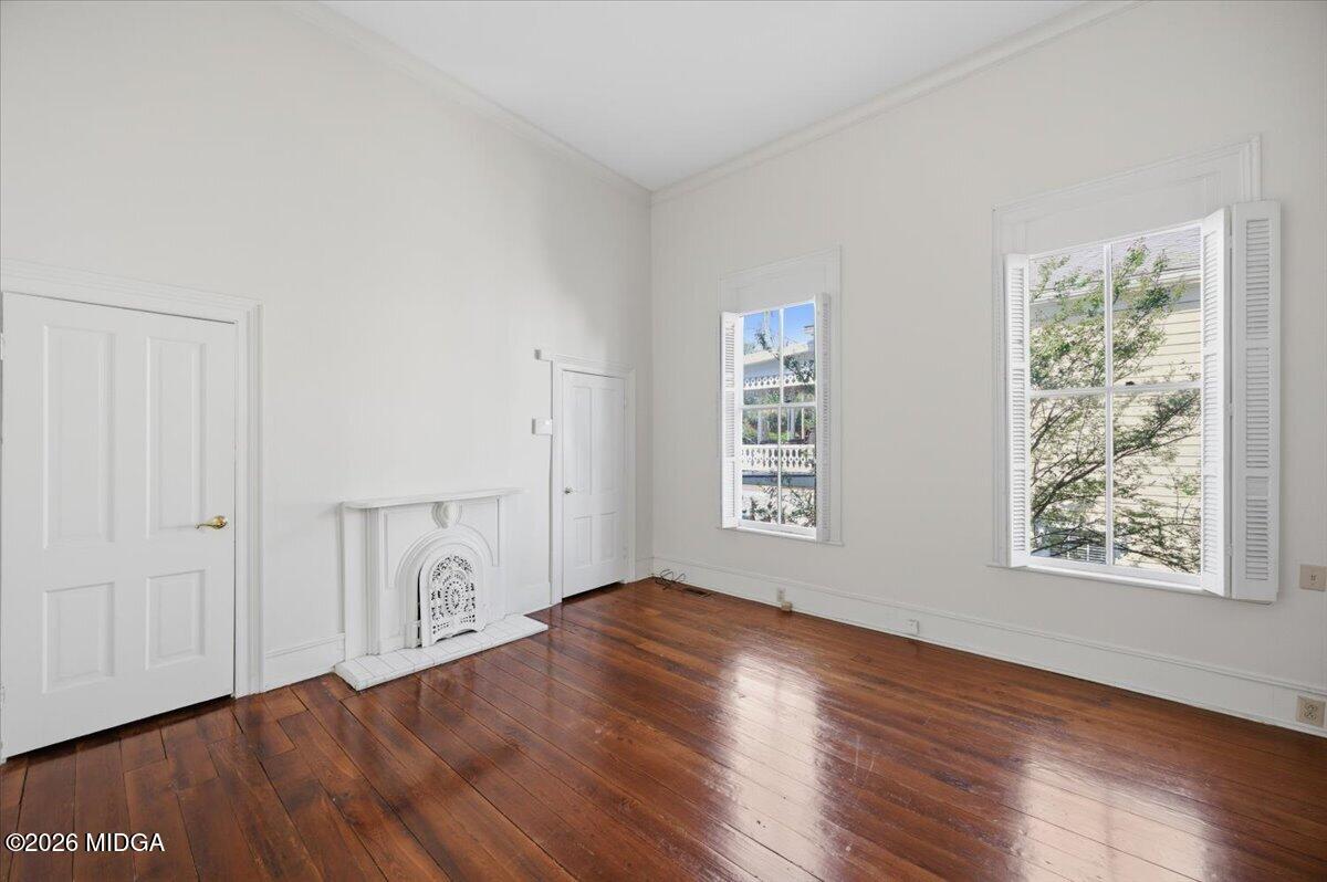 1019 Bond Street Macon, GA 31201 - Photo 36 of 56 an empty room with wooden floor and windows
