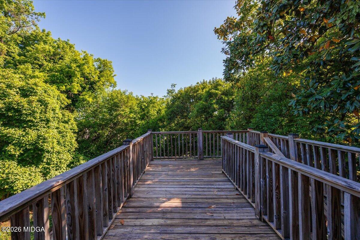 1019 Bond Street Macon, GA 31201 - Photo 40 of 56 a view of balcony with wooden fence and trees