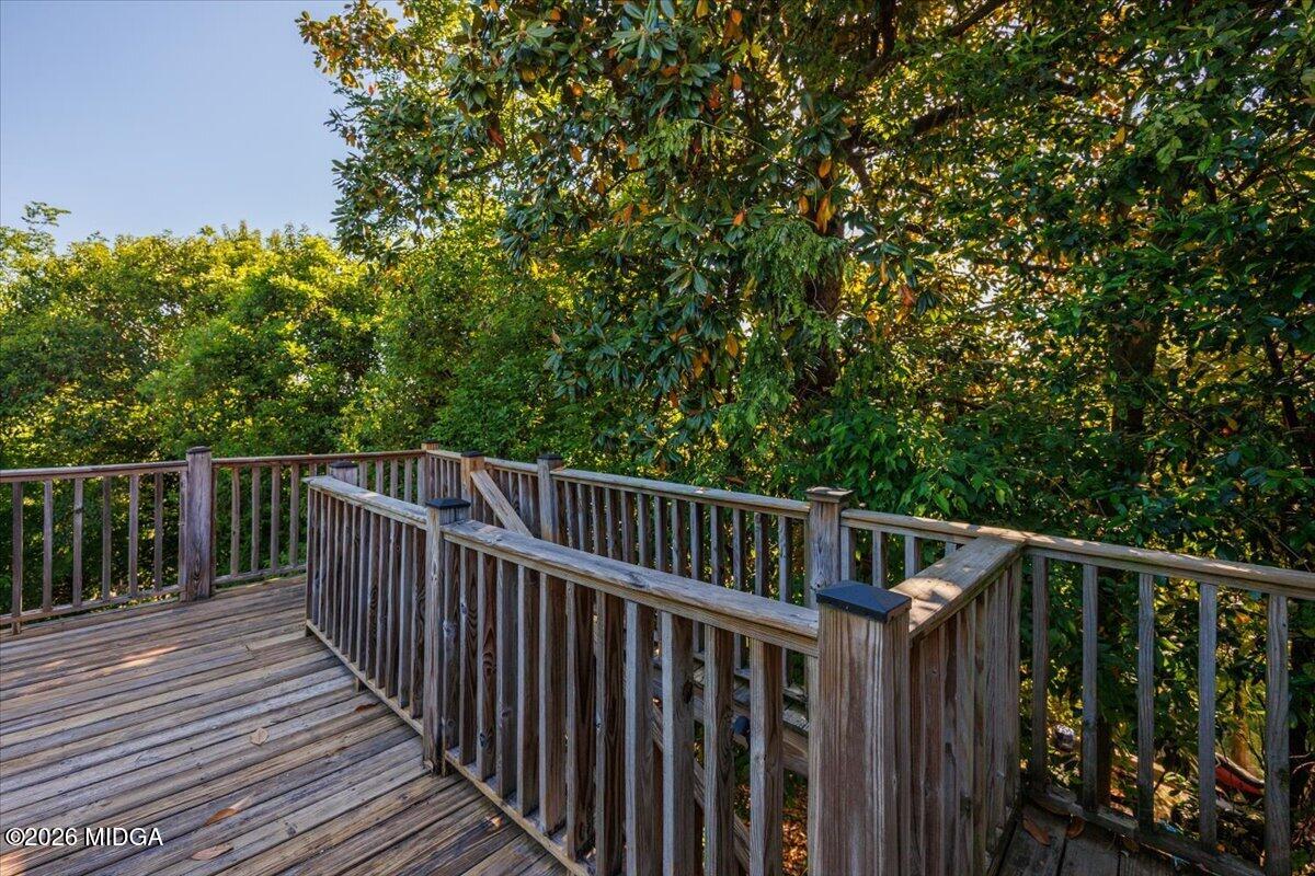 1019 Bond Street Macon, GA 31201 - Photo 41 of 56 a view of balcony with wooden fence and trees