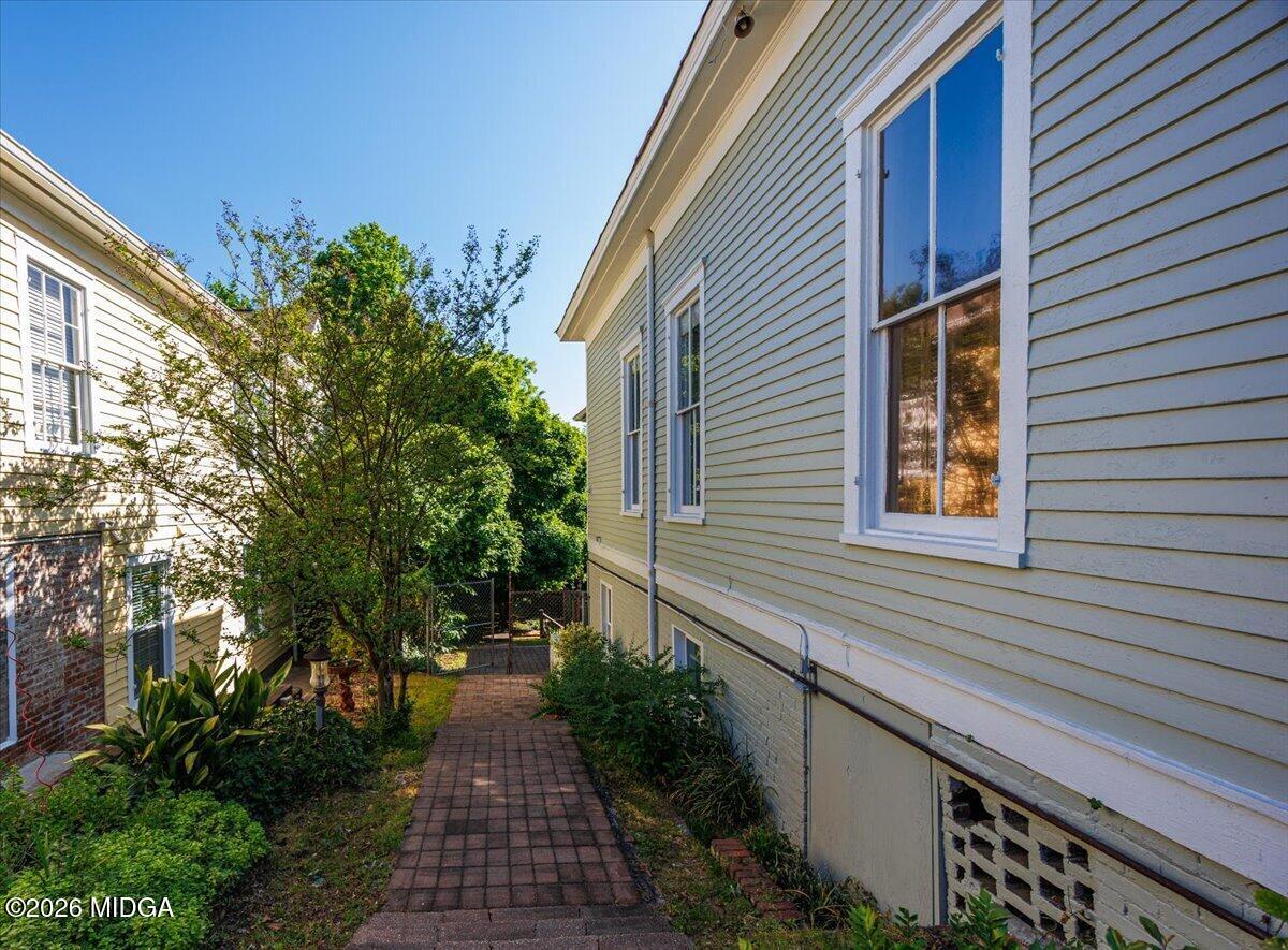 1019 Bond Street Macon, GA 31201 - Photo 43 of 56 a pathway of a house with potted plants