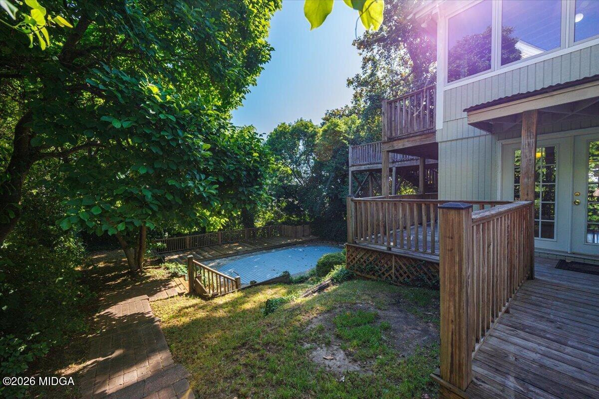 1019 Bond Street Macon, GA 31201 - Photo 44 of 56 a view of a deck with backyard and wooden fence