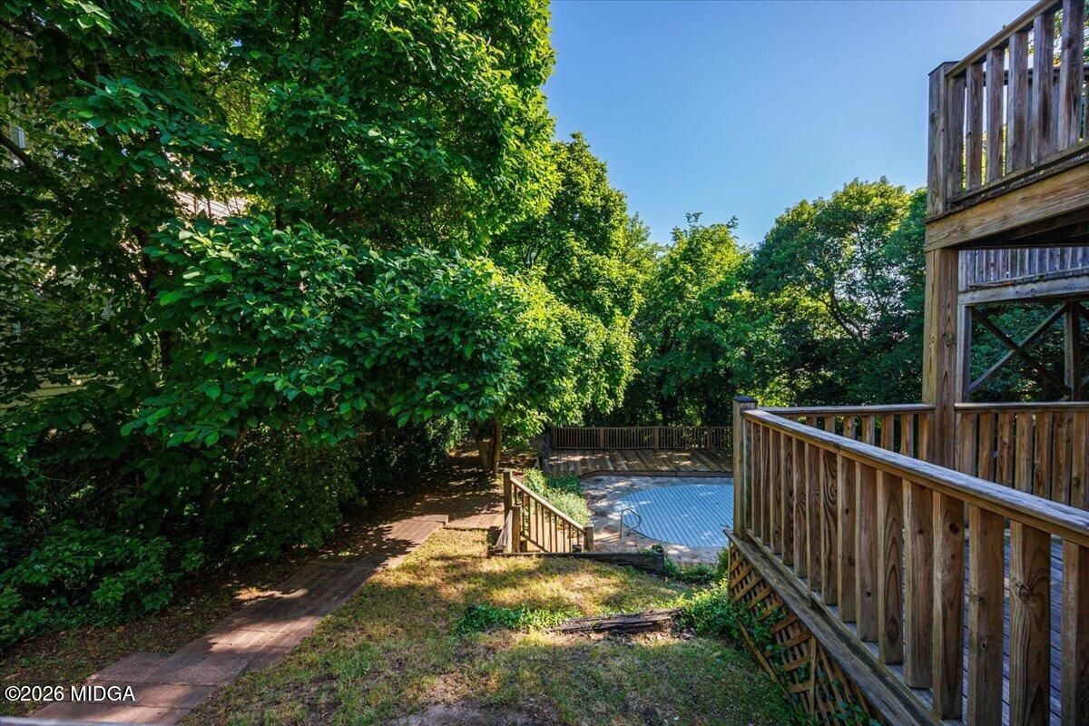1019 Bond Street Macon, GA 31201 - Photo 45 of 56 a view of a swimming pool with a patio and a yard