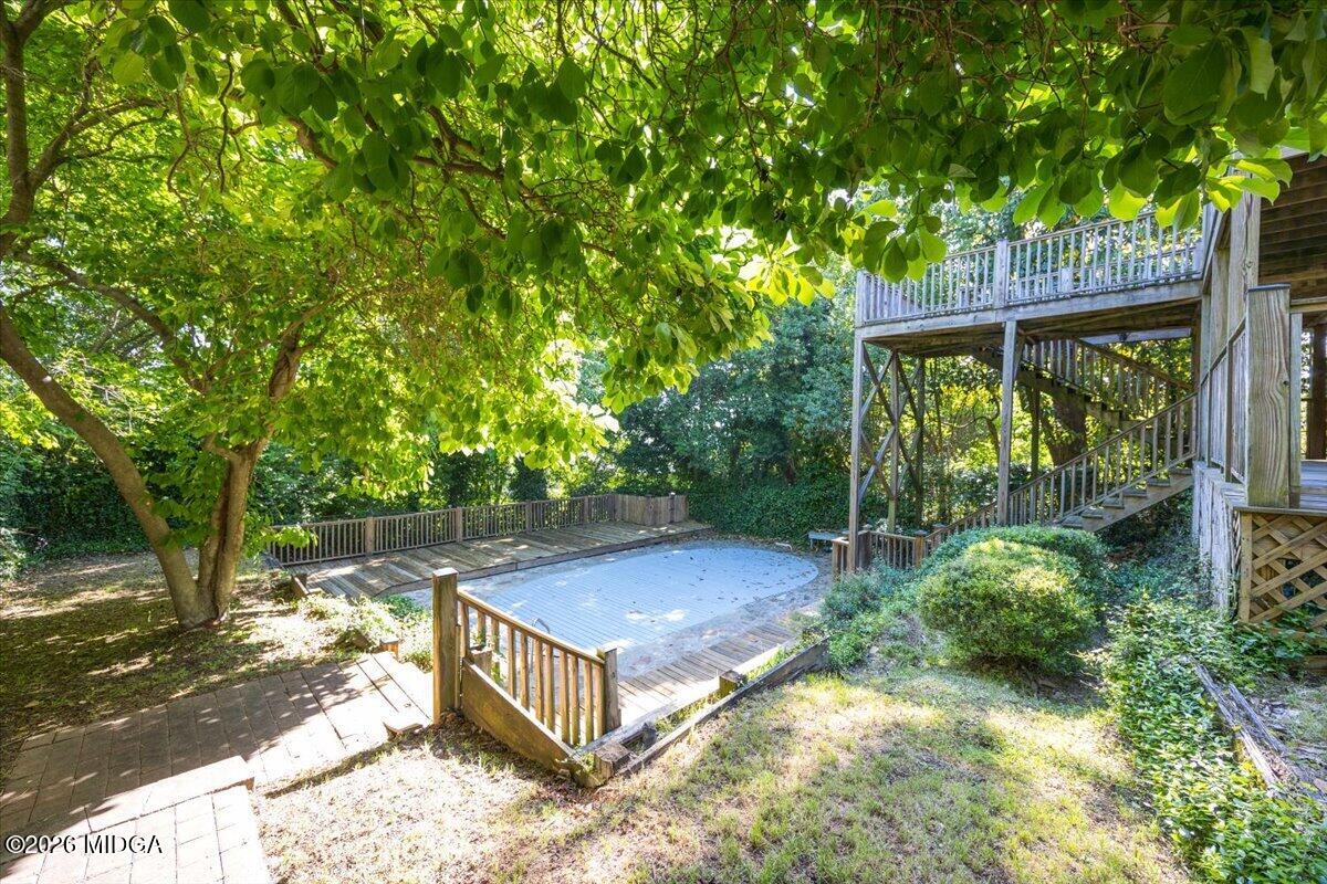 1019 Bond Street Macon, GA 31201 - Photo 48 of 56 a view of backyard with plants and large trees
