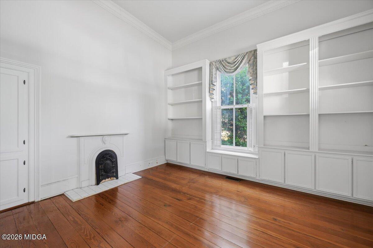 1019 Bond Street Macon, GA 31201 - Photo 5 of 56 a view of empty room with wooden floor and fan