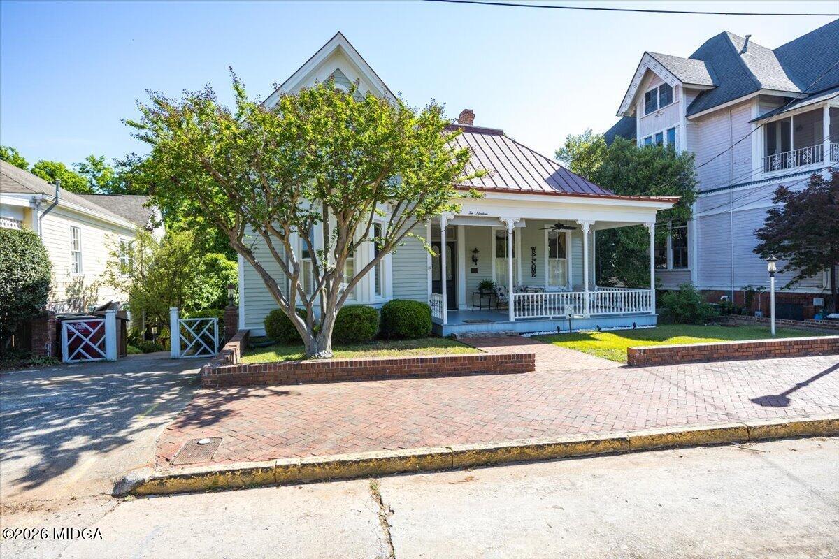 1019 Bond Street Macon, GA 31201 - Photo 54 of 56 a view of a house with a swimming pool and a yard