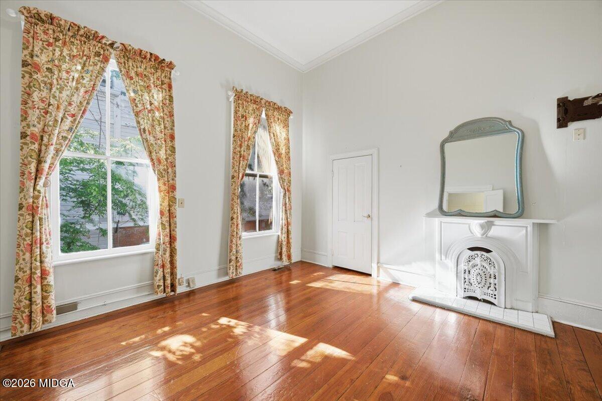 1019 Bond Street Macon, GA 31201 - Photo 9 of 56 a view of a livingroom with wooden floor and a flat screen tv