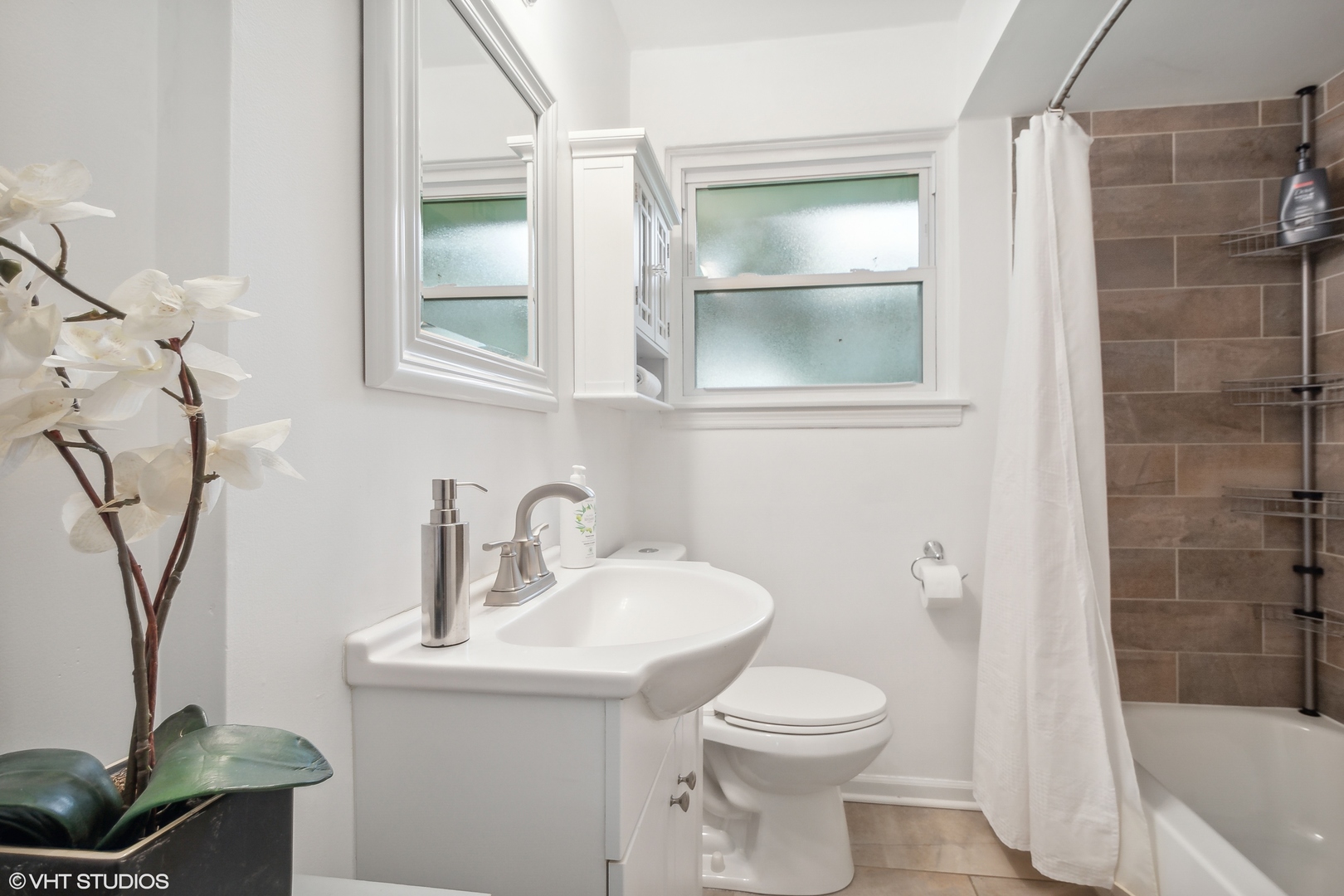 810 Shermer Road Glenview, IL 60025 - Photo 11 of 22 a bathroom with a sink toilet and shower