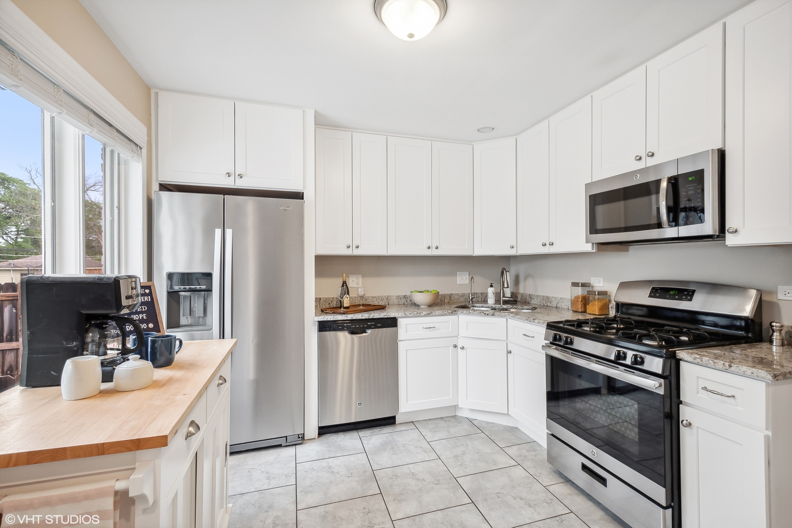 810 Shermer Road Glenview, IL 60025 - Photo 5 of 22 a kitchen with a sink stove and refrigerator