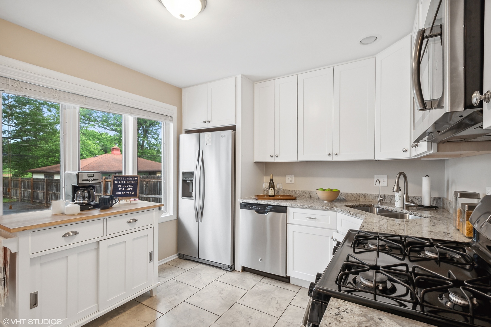 810 Shermer Road Glenview, IL 60025 - Photo 6 of 22 a kitchen with stainless steel appliances a stove a sink and a refrigerator
