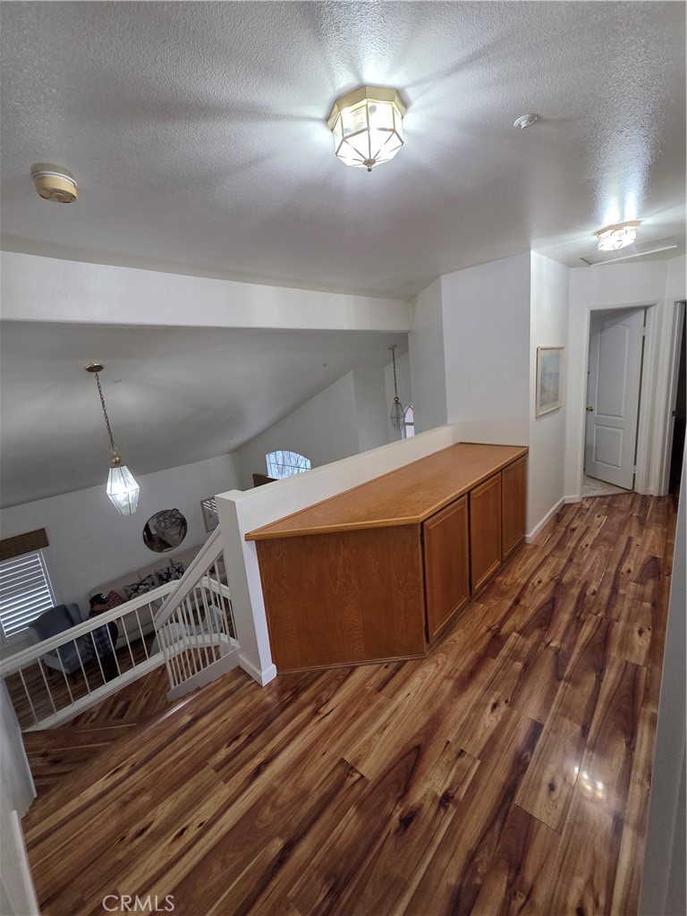 1669 West Victoria Street Rialto, CA 92376 - Photo 11 of 22 a bedroom with a bed and a chandelier