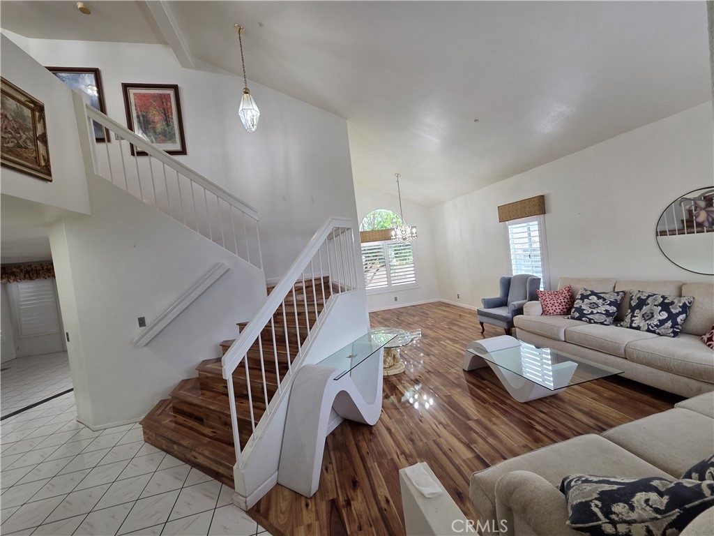 1669 West Victoria Street Rialto, CA 92376 - Photo 16 of 22 a living room with furniture and stairs
