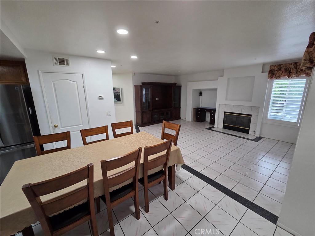 1669 West Victoria Street Rialto, CA 92376 - Photo 17 of 22 a living room with furniture a flat screen tv and a fireplace
