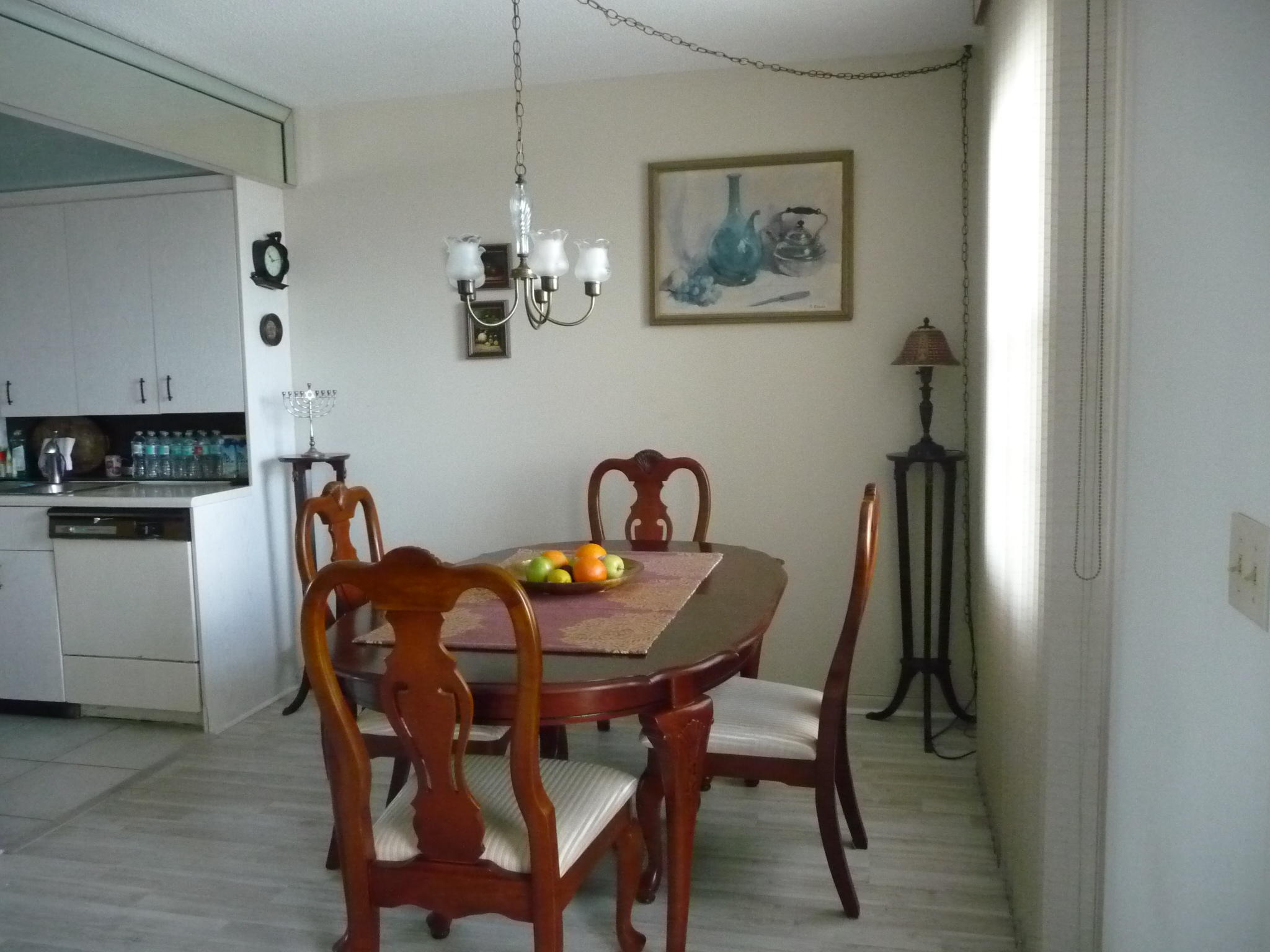 4057 Exeter Boca Raton, FL 33434 - Photo 3 of 10 a view of a dining room with furniture and chandelier