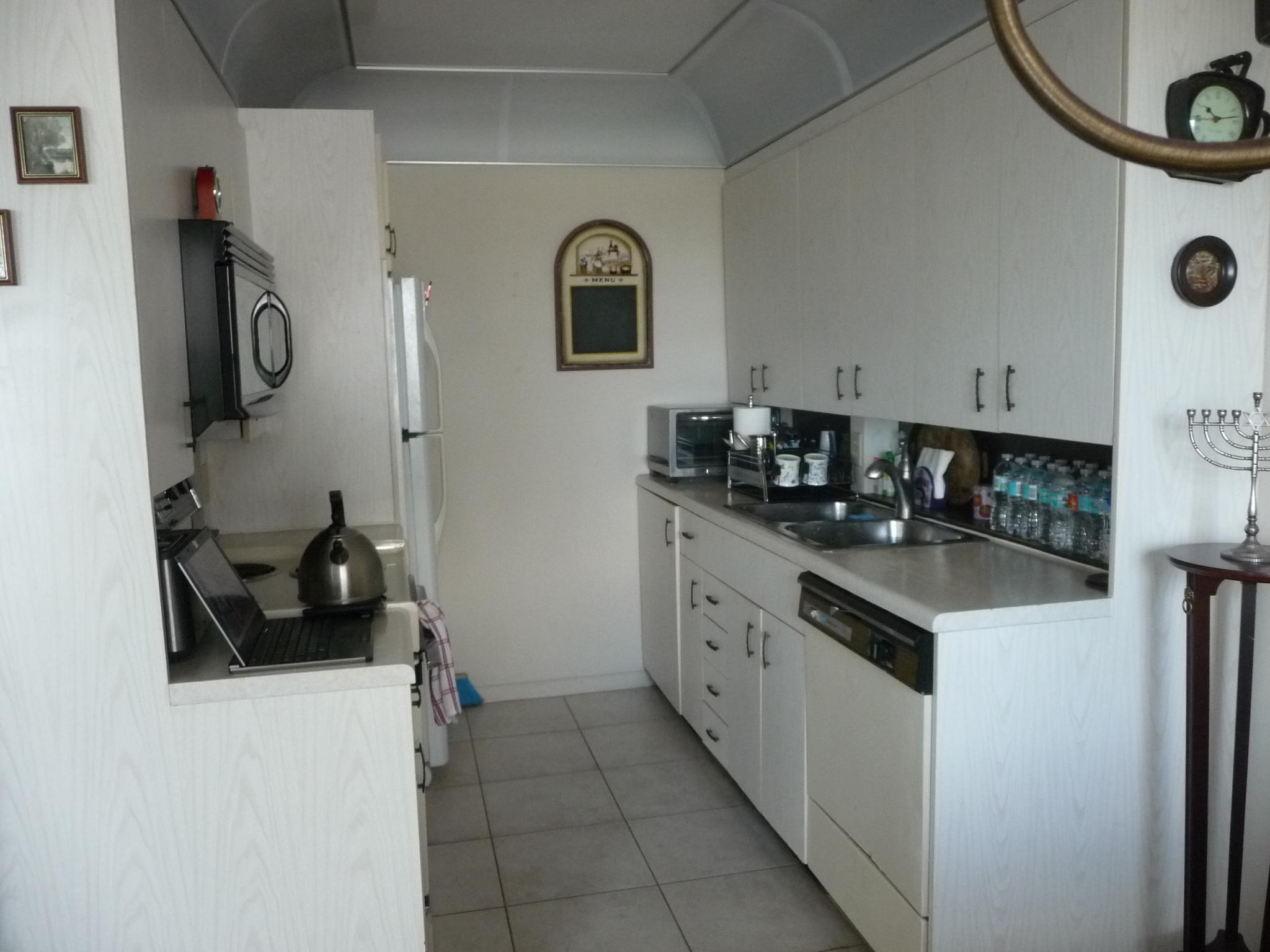 4057 Exeter Boca Raton, FL 33434 - Photo 4 of 10 a kitchen with stainless steel appliances granite countertop a sink and a stove top oven