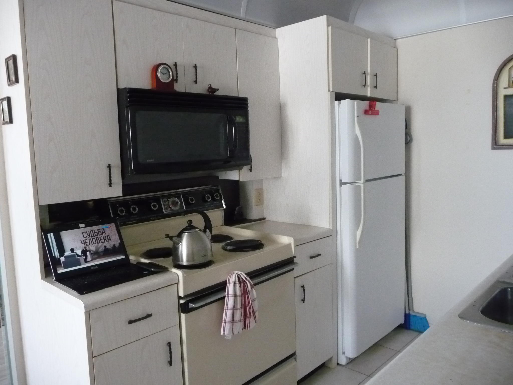 4057 Exeter Boca Raton, FL 33434 - Photo 5 of 10 a kitchen with appliances a sink and cabinets