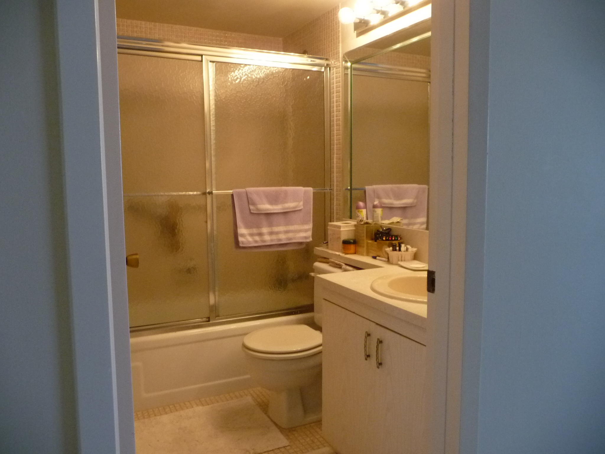 4057 Exeter Boca Raton, FL 33434 - Photo 7 of 10 a bathroom with a granite countertop sink toilet and shower