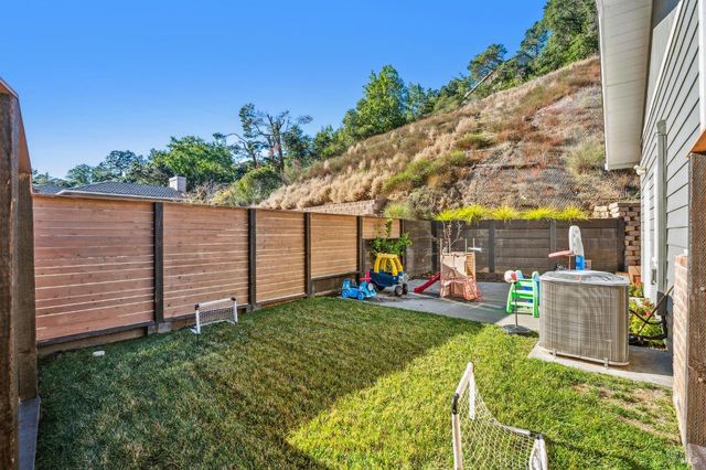 a view of a backyard with sitting area