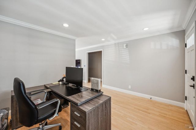 a view of workspace with wooden floor