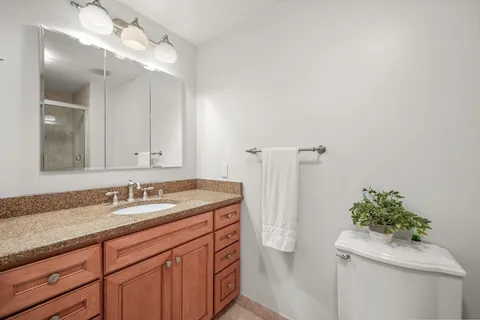 a bathroom with a sink and vanity