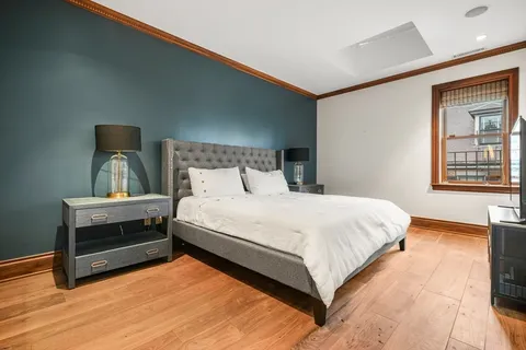 a bedroom with a bed and window