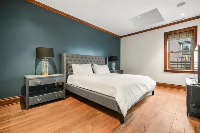 a bedroom with a bed and window