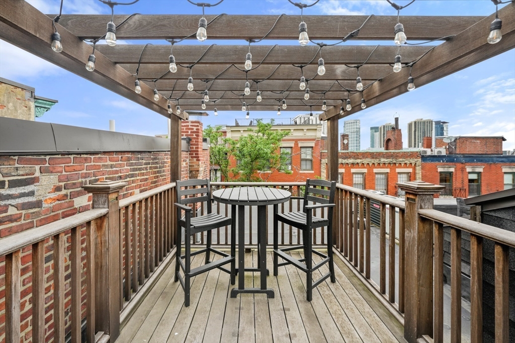 102 Myrtle Street Boston, MA 02114 - Photo 16 of 20 a view of a chairs and table in the balcony