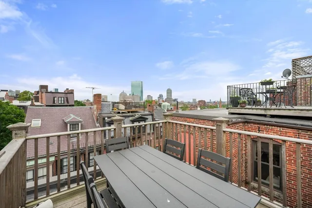 a view of a balcony with wooden floor