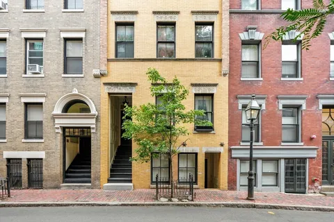 a front view of a multi story residential apartment building