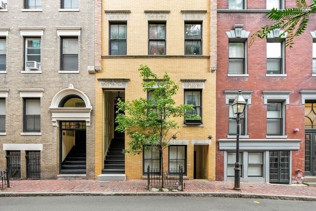 a front view of a multi story residential apartment building