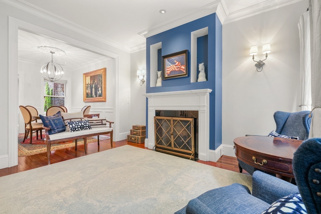 102 Myrtle Street Boston, MA 02114 - Photo 2 of 20 a living room with furniture and a fireplace
