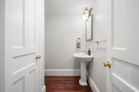 a bathroom with a sink a mirror and a bathtub