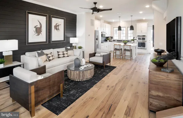 a living room with fireplace furniture and a flat screen tv