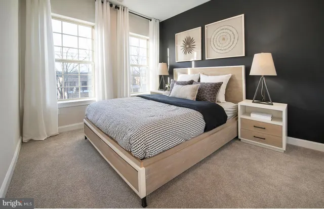 a bed room with a bed and a night stand