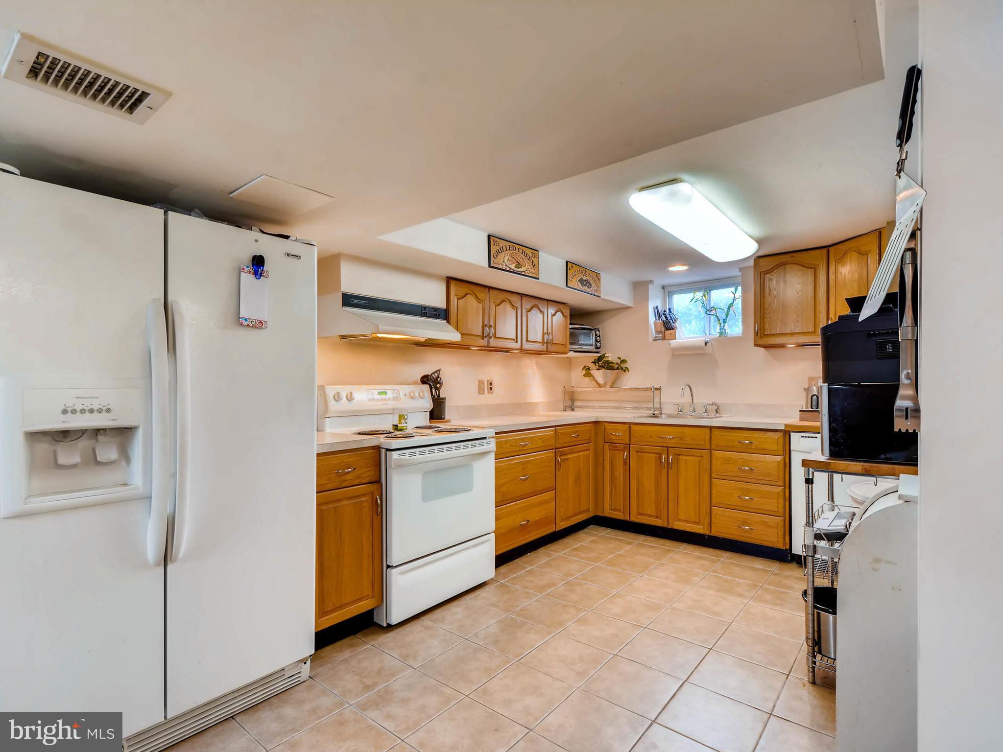5913 Meadow Road Baltimore, MD 21206 - Photo 16 of 28 Large kitchen in LL leads to backyard oasis