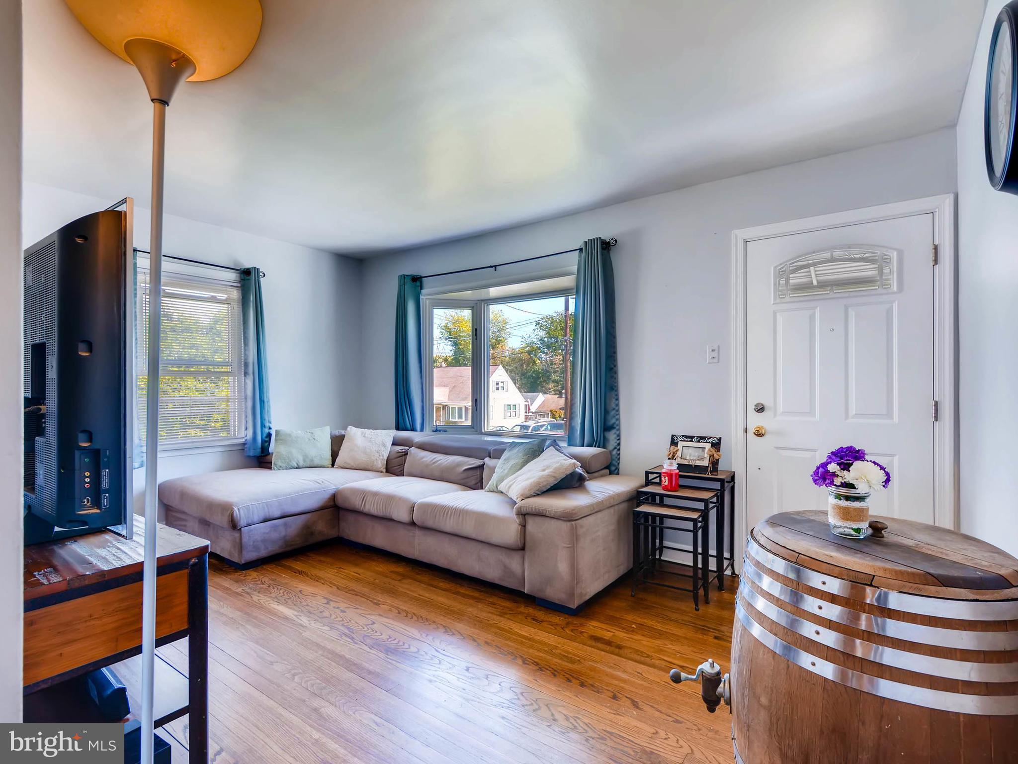 5913 Meadow Road Baltimore, MD 21206 - Photo 6 of 28 Living Room offer beautiful hardwood floors
