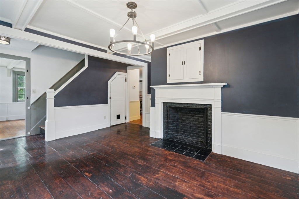 409 Main Street Townsend, MA 01474 - Photo 17 of 35 a view of an empty room with wooden floor and a fireplace