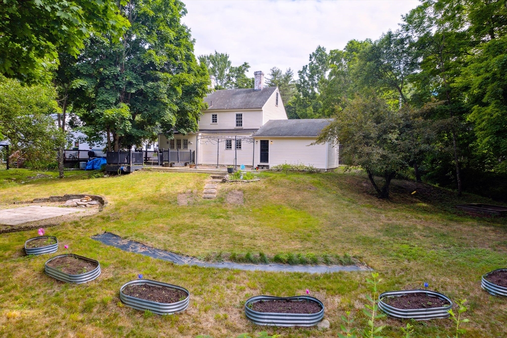 409 Main Street Townsend, MA 01474 - Photo 3 of 35 a view of a swimming pool with lounge chairs
