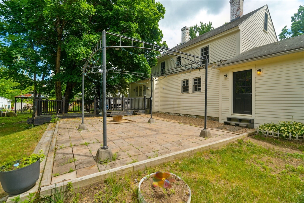 409 Main Street Townsend, MA 01474 - Photo 31 of 35 a backyard of a house with table and chairs