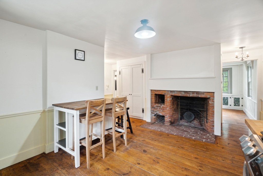 409 Main Street Townsend, MA 01474 - Photo 6 of 35 a view of a livingroom with furniture and a fireplace