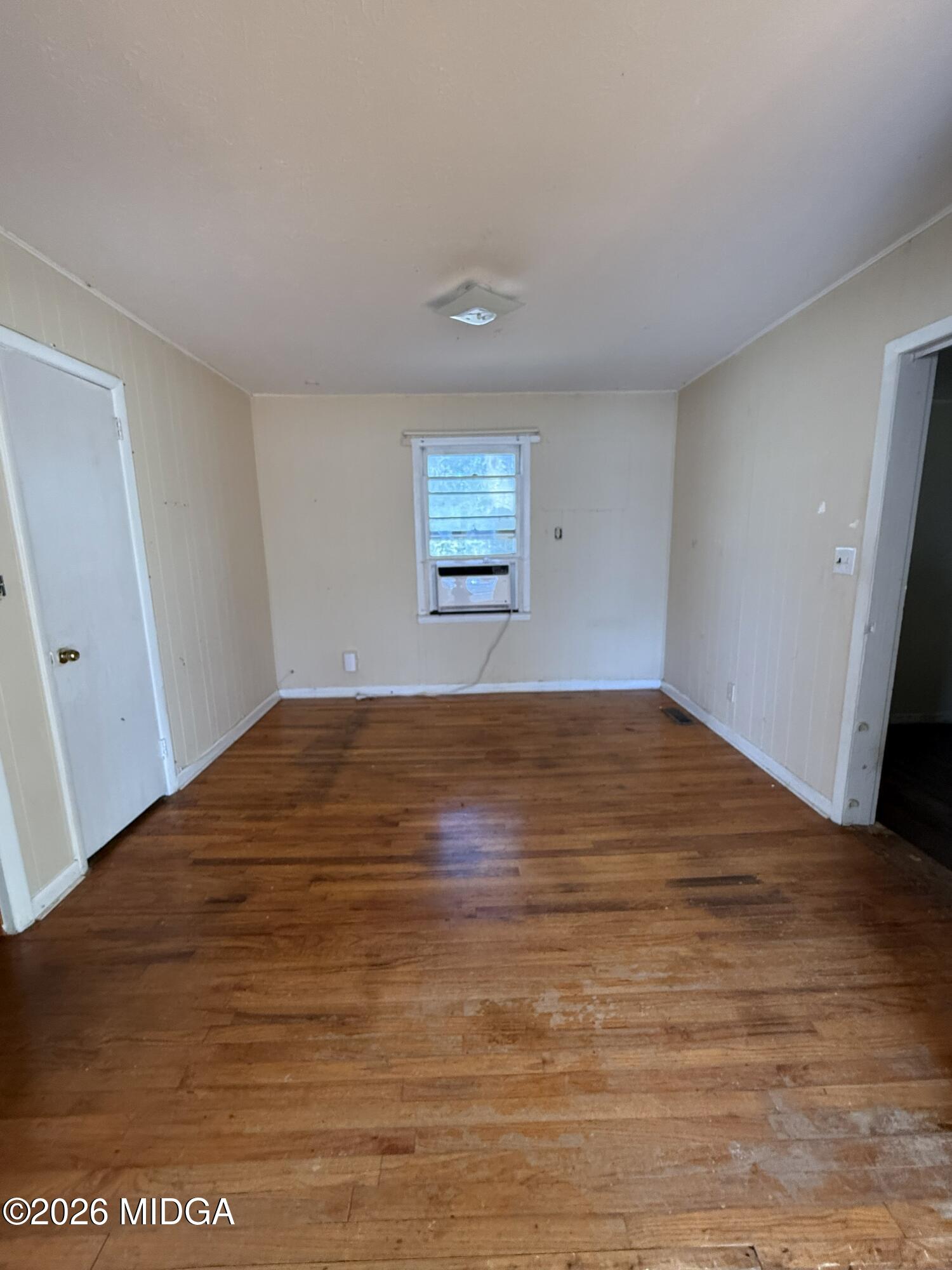 145 Edmondson Circle Cochran, GA 31014 - Photo 8 of 13 a view of empty room with wooden floor