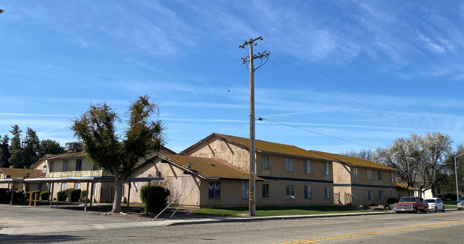 657 West Parlier Avenue, Unit 114 Reedley, CA 93654 - Photo 1 of 3 a front view of a house with a garden